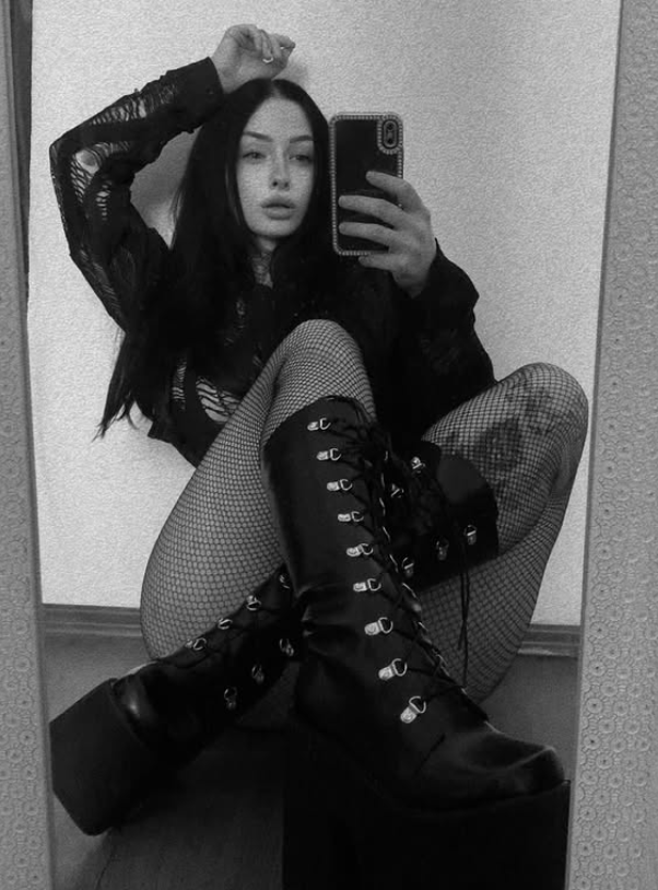 Tereza Šimánová dressed in a sexy black outfit